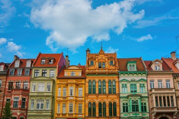 Fototapeta premium Vibrant Residential Buildings Under a Clear Blue Sky