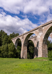 Fototapeta premium Old concrete railway bridge seen from below