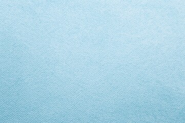 Obraz premium Light blue coarse porous polypropylene non-woven textile background texture