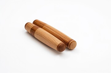Detailed view of wooden percussion sticks resting on a light surface