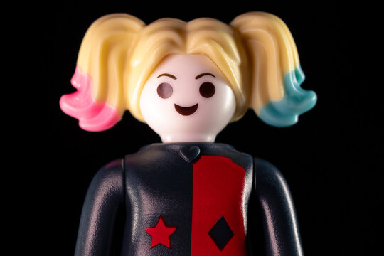 DC Harley Quinn face closeup on a black background