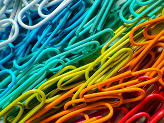 colorful paper clips on a white background