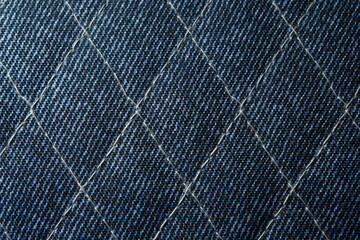 Obraz premium Closeup of Quilted Blue Denim Fabric Texture