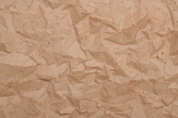 Fototapeta premium Horizontal kraft paper with a soft, natural aesthetic and distinctive clumped brown texture background