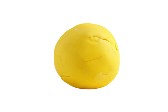 A vibrant yellow clay ball resting on a clean surface in a well-lit room, ready for creative sculpting and artistic playtime isolated on transparent background