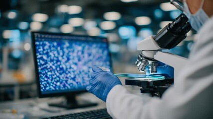 Close-up of DNA samples under a microscope, with a researcher adjusting focus in a high-tech lab setting. - Powered by Adobe