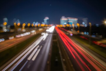 Obraz premium Nighttime Blur of a Highway with Bokeh Lights