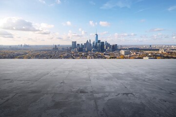 Obraz premium Concrete square pavements enclosed by a wide cityscape and tall structures.