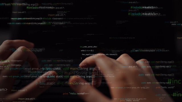 Close-up view of hands typing on a laptop keyboard with abstract programming code in the background, illustrating the essence of digital technology and coding activities. Xenic