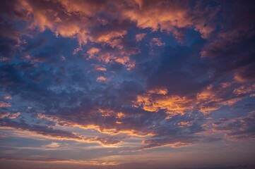 Obraz premium Sunset with vibrant orange clouds lighting up the sky