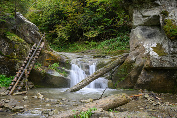 Waterfall Vorota, Bukovynski cascades in Velykyi Roztoky in the autumn forest. Carpathian Mountains, Chernivtsi oblast, Ukraine.