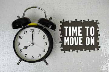 Time To Move On text with alarm clock on gray background