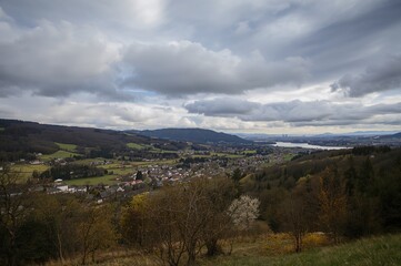 Overcast early spring sky above a mountain hamlet, artistic landscape rendition