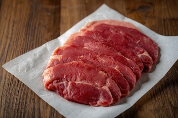 Newly sliced meat displayed at a meat counter