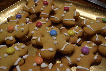 Gingerbread men christmas cookies with icing and colorful chocolate buttons