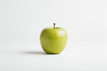 Fresh green apple isolated on white background with selective focus, emphasizing health and nutrition