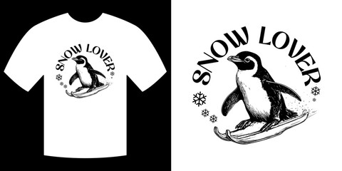 Snow Lover Tee Design: The charming monochrome design features a penguin, the star of the show, and snowflakes on a t-shirt that's bound to be the next big hit for snow lovers.