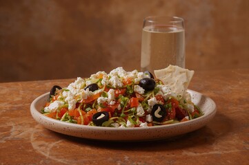 Mediterranean salad featuring crisp veggies, creamy feta, and dark olives