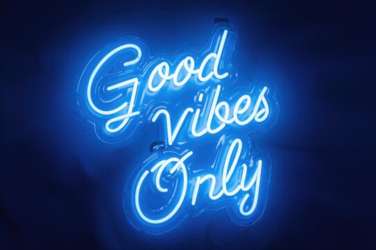 Neon sign displaying positive energy phrases