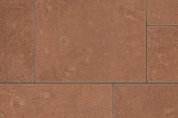 Fototapeta premium Surface made of brown earthenware tiles, ideal for texture and backdrop