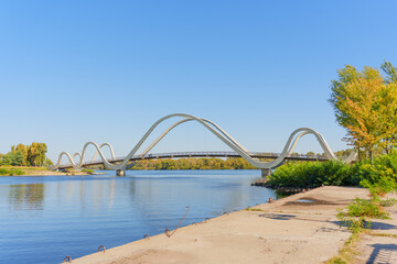 Stunning View of Volna Pedestrian Bridge Over the Calm Dnieper River in Kyiv