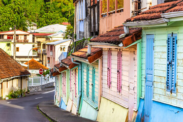 Colorful houses in Grande Riviere, Martinique, France, along General Charles de Gaulle Avenue. Grand Riviere the northernmost town of the Caribbean island of Martinique.