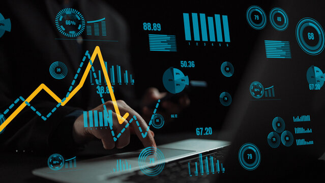 A professional hands-on financial analysis with charts and statistics displayed on a laptop. Ideal for concepts of data visualization, business intelligence, and performance insights. Xenic