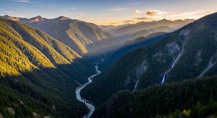 Obraz premium River winding through a valley with tall mountains