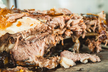 Extreme close up of a perfectly grilled beef rib, sliced to reveal the incredibly juicy and tender interior. Meat fibers and smoky crust visible.
