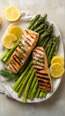 Grilled Salmon with Asparagus and Lemon Slices on White Plate Closeup