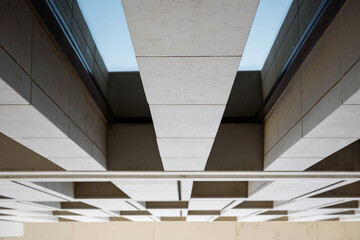 Obraz premium Modern architectural detail with geometric patterns and shadows, showcasing sleek urban design elements in a minimalistic style.