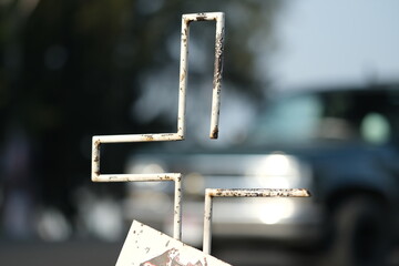 incomplete urban cross, in the middle of the city, people installs crosses to remember where their...