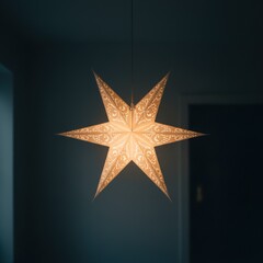 Fototapeta premium A warm glow emanates from a festive paper star light hanging indoors, creating a cozy and inviting atmosphere.