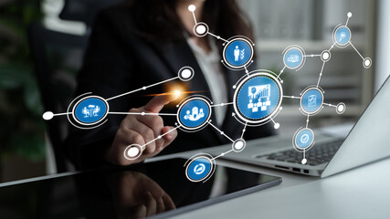 A businesswoman engages with a digital interface, exploring data charts and innovative technology solutions in a modern office setting, showcasing corporate strategy and analytics. Tessel