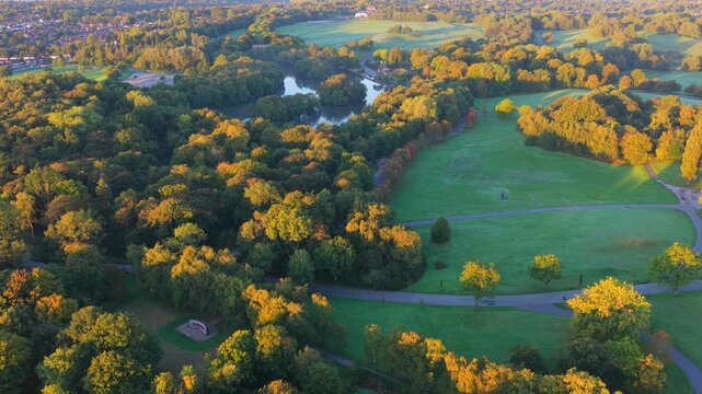 Aerial sunrise video of Heaton Park, Manchester with Boating Lake and Somme Memorial in a view. 
