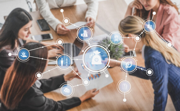 A diverse group of professional women collaborate during a business meeting, surrounded by digital icons and graphs that symbolize innovative strategies and teamwork. Tessel