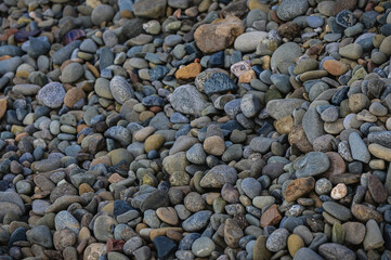 Sea stones on the beach background