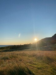 Sunset in Iceland Westfjords with mountains and tall grass