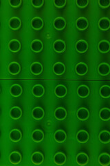 Fototapeta premium Bright green building base ideal for creative construction projects