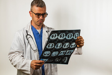 Medical professional examines CT scan results in a clinical setting