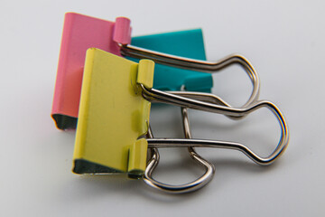 Colorful binder clips neatly arranged for desk organization