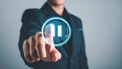 Businessman holding holographic pause icon for futuristic technology and corporate vision