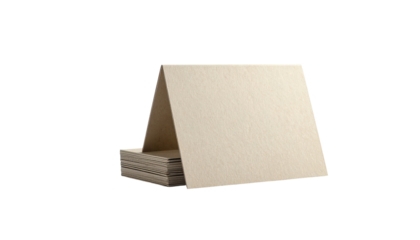 Blank note cards stacked.  A stack of light beige note cards,  triangularly-shaped, rests on top of a stack of more cards.  Simple, neutral color scheme