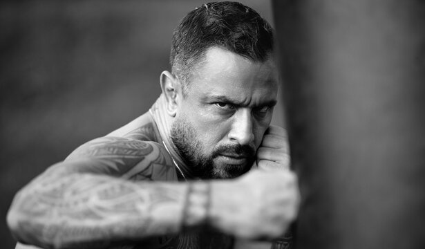 Fighter man punching boxing bag. Man boxer. Mans fight. Guy ready for boxings challenge. Man fight. Boxings fight. Boxing sport. Strong muscle. Boxer punching bag with strong fist.