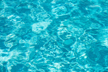 Blue ripped water in swimming pool, water pool texture and surface water backgraund.