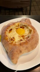 Traditional Adjarian Khachapuri Georgian Cheese Bread with Egg and Butter
