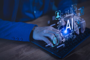 Close-up of hands typing on laptop with glowing AI icons, representing artificial intelligence, machine learning, digital innovation, data technology, and futuristic computer science.
