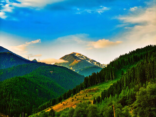 sunset in the mountains. mountain, landscape, nature, sky, mountains, forest, alps, clouds, view, tree, cloud, summer, snow, panorama, valley, peak, green, rock, trees, park, hill, travel, high, touri