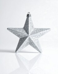 Silver Star Decoration with Glitter Reflecting on White Surface
