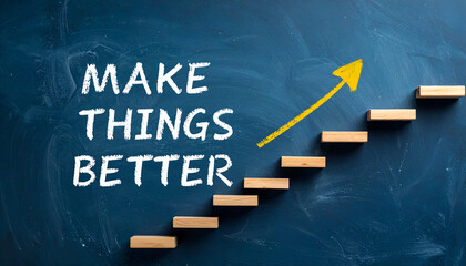 Motivational concept with “Make Things Better” text and upward arrow drawn on chalkboard.